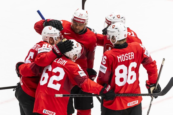 Switzerland&#039;s forward Sven Andrighetto, left, celebrates his goal with his teammates Switzerland&#039;s forward Denis Malgin #62 and Switzerland&#039;s forward Nino Niederreiter #22, Switzerland& ...