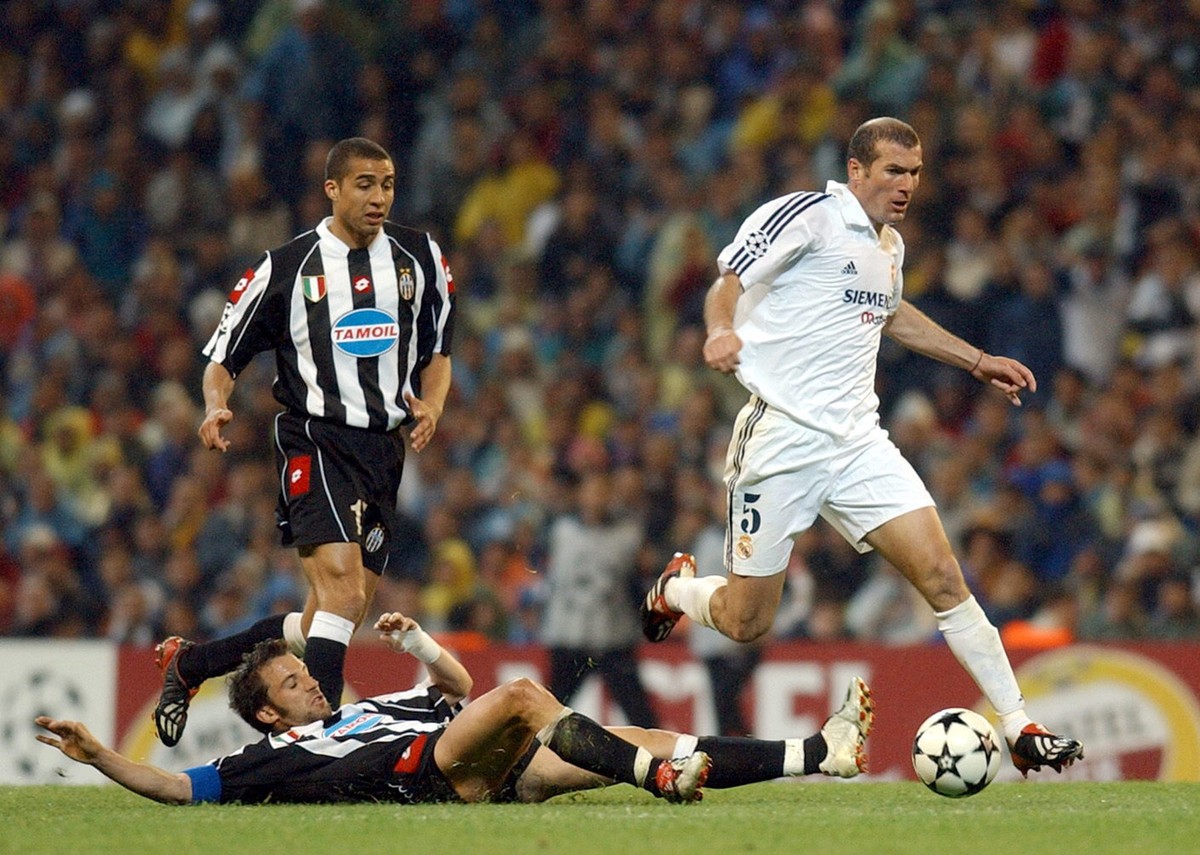 Juventus' Alessandro Del Piero, bottom left, steals the ball from Real Madrid's French player Zinedine Zidane, right, as Juventus' David Trezeguet watches on during a semifinal first le ...