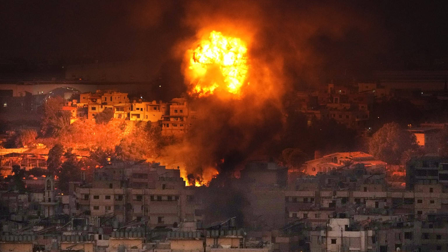 Flames rise after an Israeli airstrike in the southern suburbs of Beirut, Lebanon, Saturday, Sept. 28, 2024. (AP Photo/Hussein Malla)