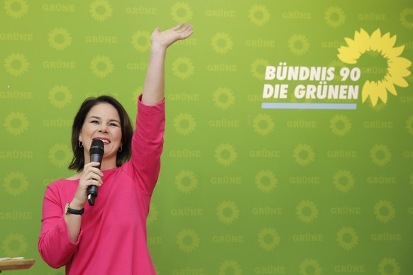 Germany&#039;s Green Party co-chairwoman Annalena Baerbock speaks to supporter after firs exit poll for the Bavarian state elections announced at the party&#039;s headquarters in Berlin, Sunday, Oct.  ...