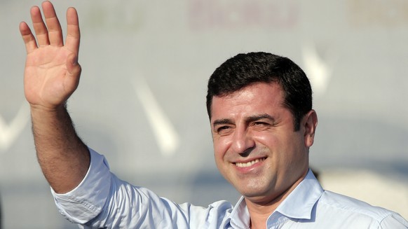 FILE - In this Sunday, Aug. 9, 2015 file photo, Selahattin Demirtas, then leader of the pro Kurdish Democratic Party of Peoples (HDP) waves to people gathered for a pro-peace rally in Istanbul. Demirt ...