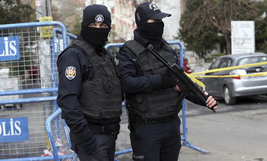 Riot police stand guard outside the headquarters of pro-Kurdish Peoples&#039; Democratic Party, or HDP, after security members detain four persons shouting slogans against HDP, in Ankara, Turkey, Tues ...