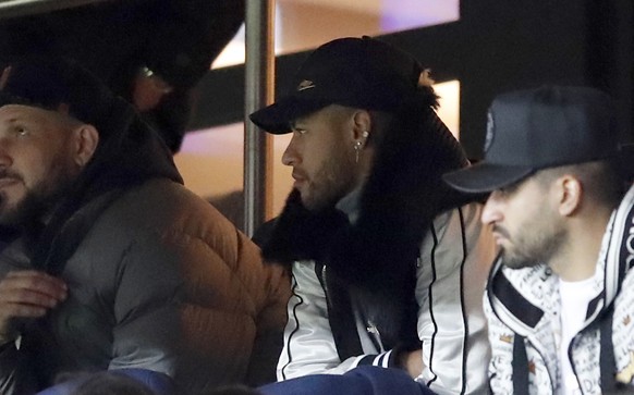 PSG&#039;s Neymar, center, watches in the tribune the French League One soccer match between Paris Saint-Germain and Bordeaux at the Parc des Princes stadium in Paris, Saturday, Feb. 9, 2019. (AP Phot ...