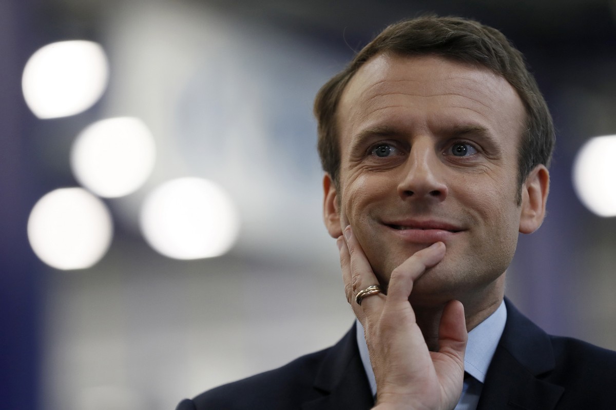 French presidential election candidate for the En Marche ! movement Emmanuel Macron reacts during his visit at the KRYS group's headquarters in Bazainville, near Paris Tuesday April 18, 2017. The ...