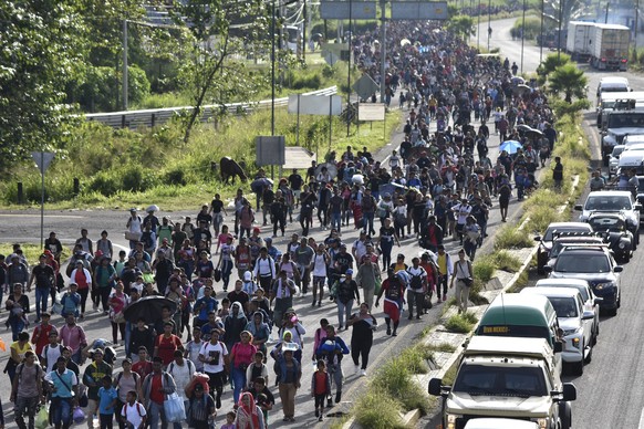Migrants who had been waiting for temporary transit papers, but failed to get them after waiting, some up to two months, leave Tapachula, Mexico, Monday, Oct. 30, 2023, as they make their way to the U ...
