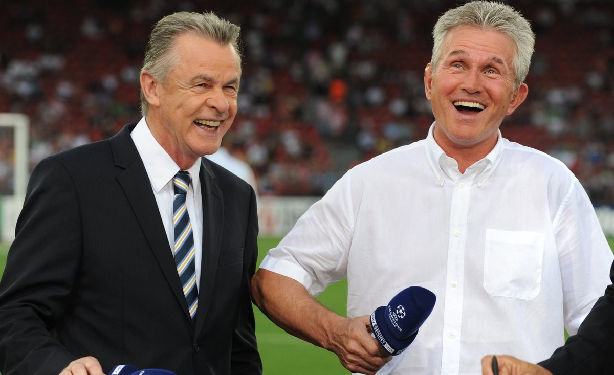 Bayern's former coach and current head coach of Switzerland's national soccer team, Ottmar Hitzfeld, left, and Bayern's coach Jupp Heynckes, right, laugh before the Champions League qua ...