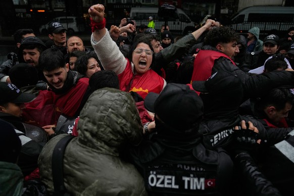Union members scuffle with Turkish police officers as they try to march towards Taksim square in Istanbul, Turkey, Friday, May 1, 2026, during Labor Day celebrations. (AP Photo/Khalil Hamra)
APTOPIX T ...