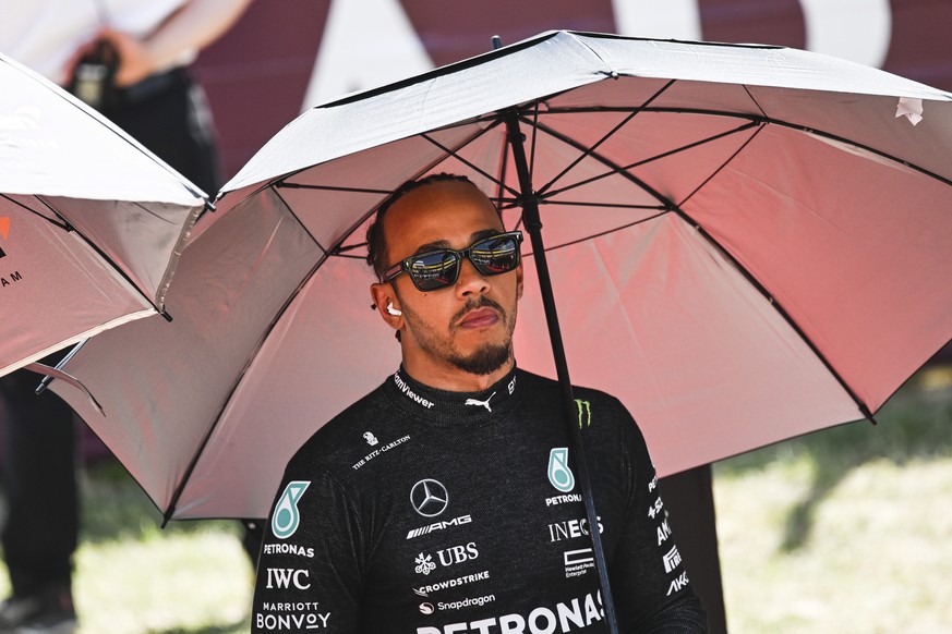 epa10764091 Mercedes-AMG Petronas driver Lewis Hamilton of Britain reacts prior to the Hungarian Formula One Grand Prix at the Hungaroring circuit, in Mogyorod, near Budapest, Hungary, 23 July 2023. E ...