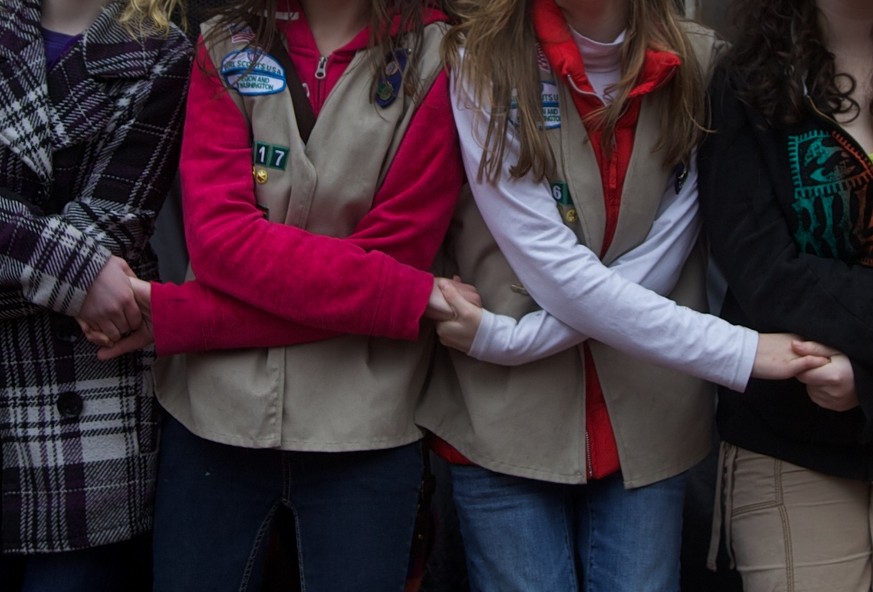 FILE - In this March 10, 2012, file photo, participants of the 100th anniversary celebration of Girl Scouts form a friendship circle at Pioneer Courthouse Square in Portland, Ore. For the second strai ...