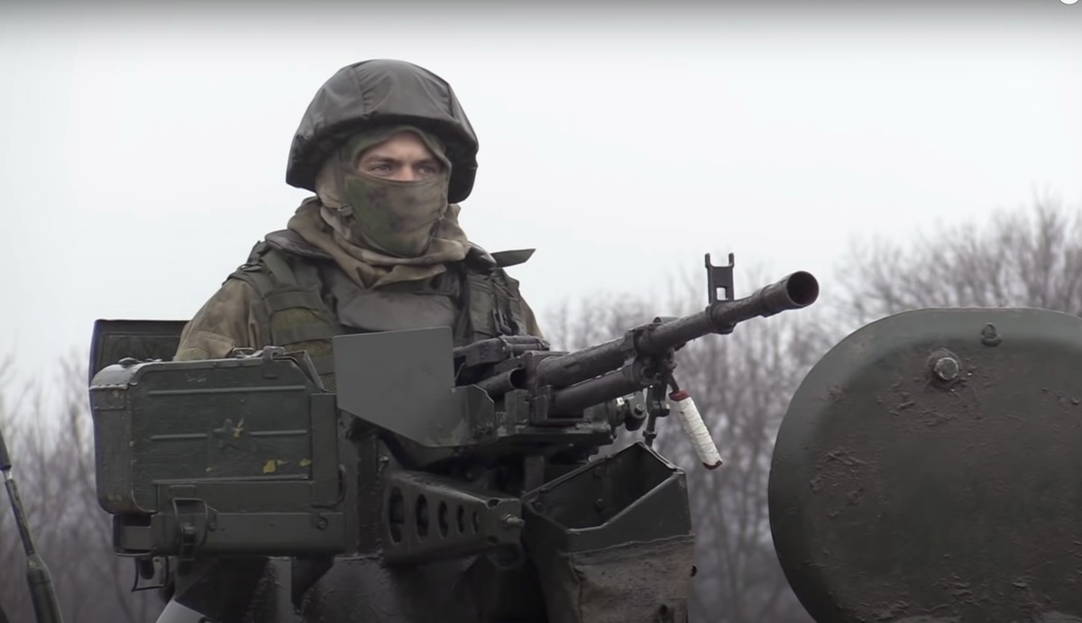 epa09800478 A still image taken from handout video made available by the Russian Defense Ministry?s press-service shows a Russian serviceman guarding a checkpoint in the Luhansk region, Ukraine, 04 Ma ...