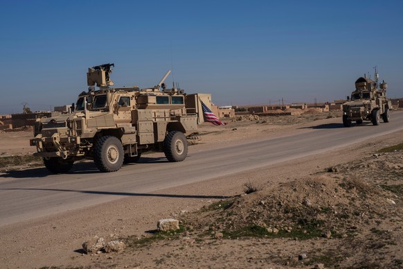 FILE - A U.S. military convoy drives along a road in northeastern Syria's Hasakeh province, Thursday, Jan. 30, 2025. (AP Photo/Bernat Armangue, File)
Syria US Troops Explainer