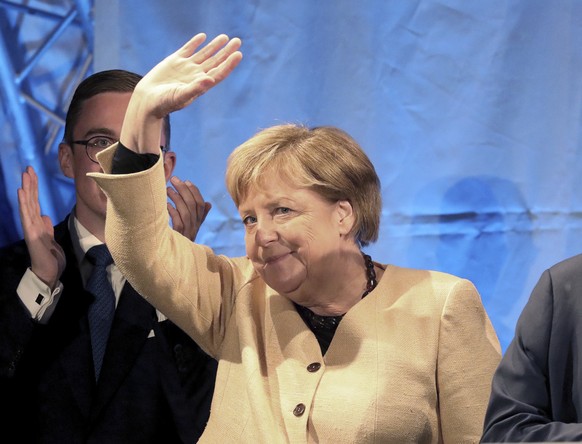 Armin Laschet, chairman of the German Christian Democratic Union (CDU) and the party&#039;s top candidate for the federal election, right, and German chancellor Angela Merkel attend a joint campaign a ...