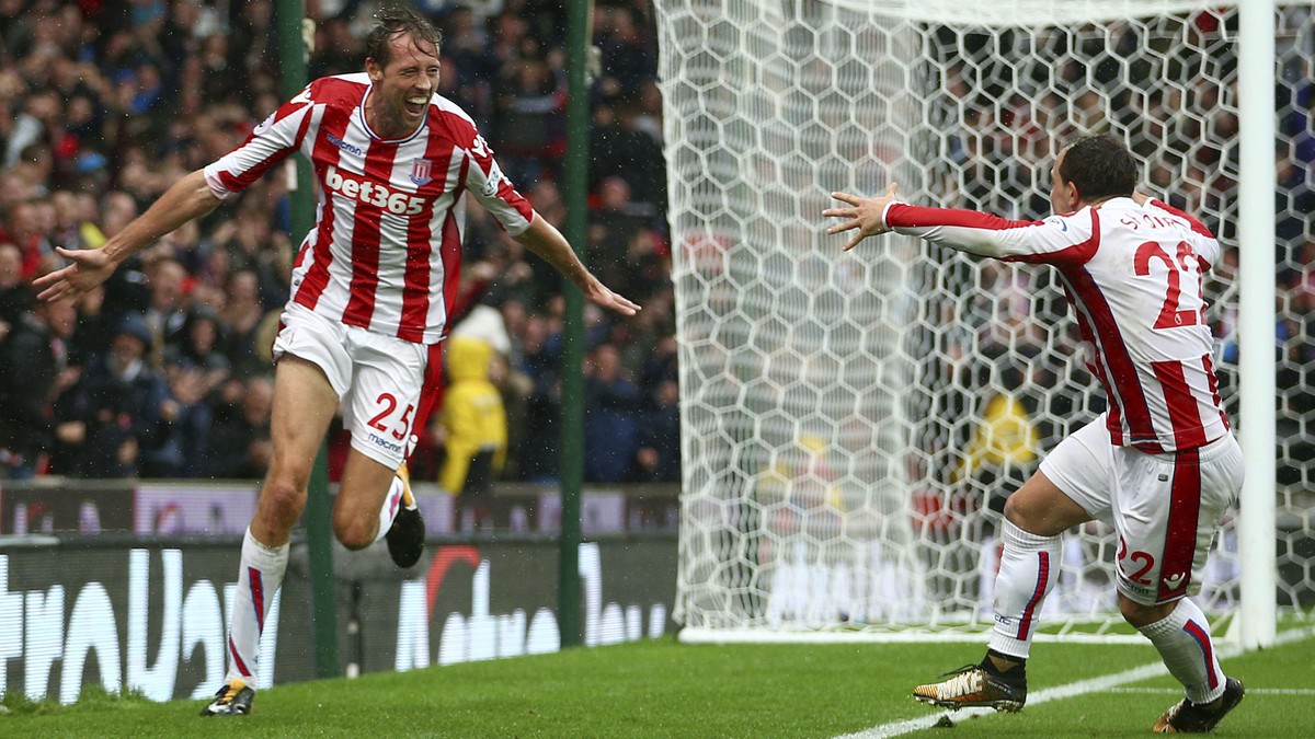 Stoke City's Peter Crouch, left, celebrates scoring his side's second goal with team-mate Xherdan Shaqiri during the English Premier League soccer match between Stoke City and Southampton at ...