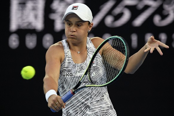 Ash Barty of Australia plays a backhand return to Camila Giorgi of Italy during their third round match at the Australian Open tennis championships in Melbourne, Australia, Friday, Jan. 21, 2022. (AP  ...