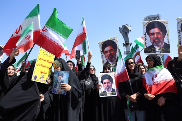 epa12896502 Iranian women hold pictures of Iranian supreme leader Ayatollah Mojtaba Khamenei during an anti-US and Israeli rally called 'sacrificed girls' in Tehran, Iran, 17 April 2026. The ...