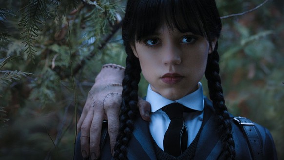 Wednesday. (L to R) Thing, Jenna Ortega as Wednesday Addams in episode 104 of Wednesday. Cr. Courtesy of Netflix © 2022