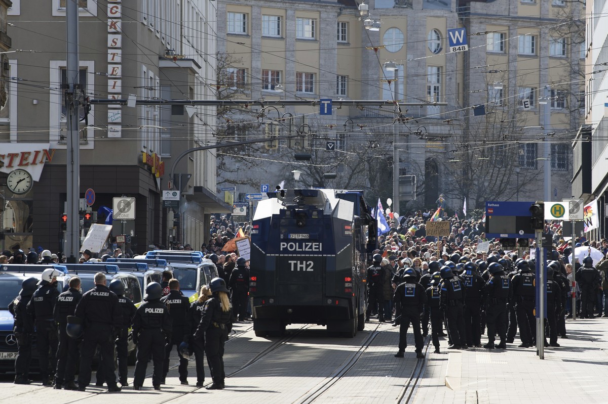Police forces stand next to a water canon during a rally under the motto "Free citizens Kassel - basic rights and democracy" i Kassel, Germany, Saturday, March 20, 2021. According to police, ...