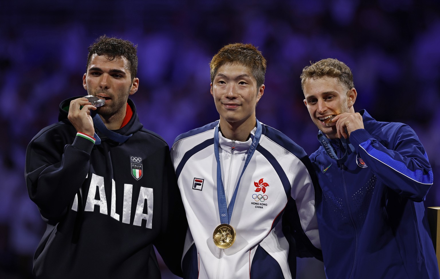 epa11507577 (L-R) Silver medalist Filippo Macchi of Italy, Gold medalist Ka Long Cheung of Hong Kong and Bronze medalist Nick Itkin of US pose during award ceremony of the Men Foil Individual in the F ...
