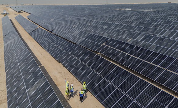 Workers walk between solar panels at a newly opened industrial-scale solar power plant in Karbala, Iraq, Wednesday, Sept. 17, 2025. (AP Photo/Anmar Khalil)
Iraq Solar Power