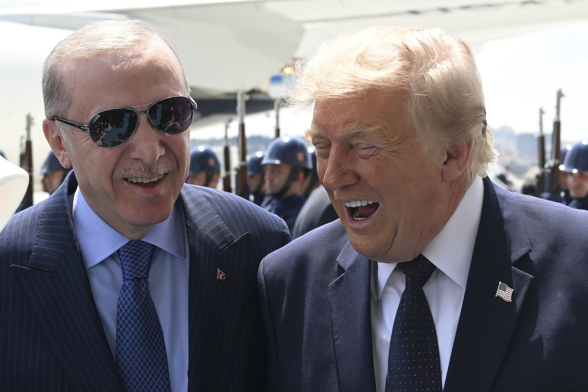 President Donald Trump, right, speaks with Turkish President Recep Tayyip Erdogan as he arrives for the NATO summit in Ankara, Turkey, Tuesday, July 7, 2026. (Do?ukan Keskink?l?ç, Pool Photo via AP)
T ...