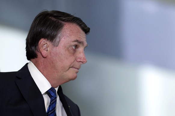 Brazil&#039;s President Jair Bolsonaro arrive to attend the launch ceremony of Brazil&#039;s genome program, at the Planalto Presidential Palace, in Brasilia, Brazil, Wednesday, Oct. 14, 2020. (AP Pho ...