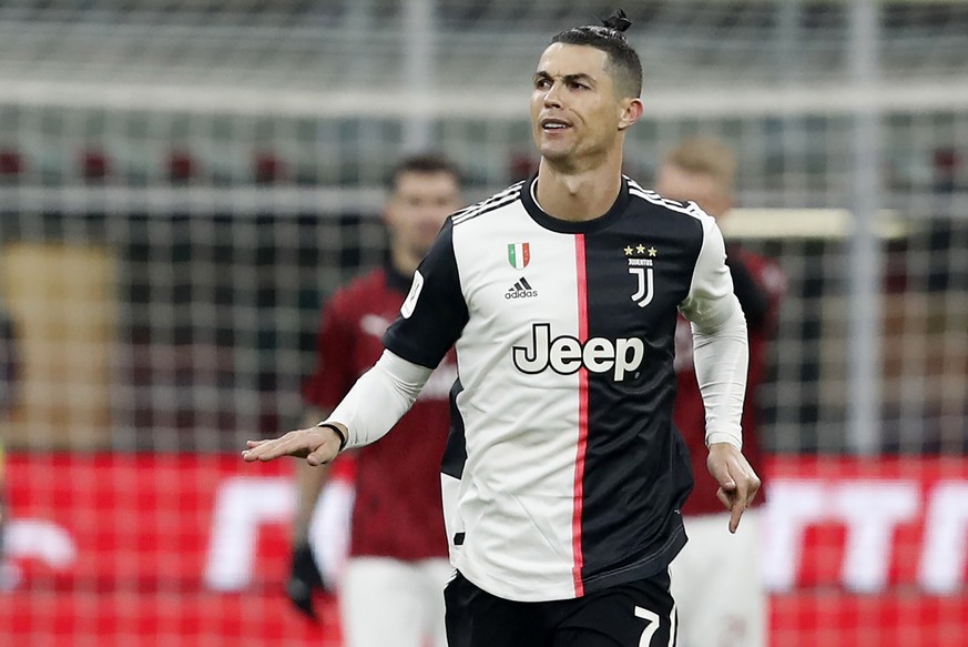 Juventus' Cristiano Ronaldo celebrate after scores with penalty against AC Milan during an Italian Cup soccer match between AC Milan and Juventus at the San Siro stadium, in Milan, Italy, Thursda ...