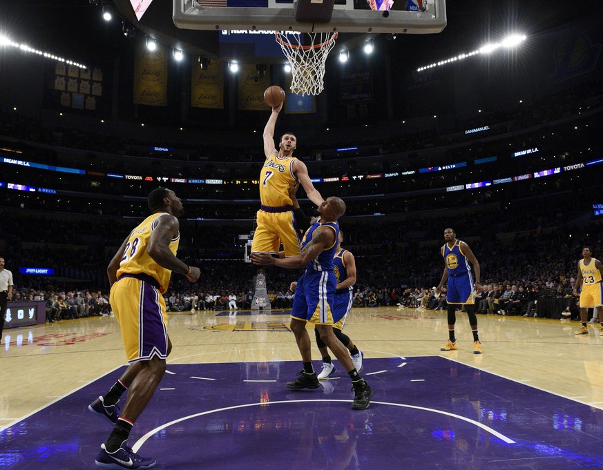 Nov 4, 2016; Los Angeles, CA, USA; Los Angeles Lakers forward Larry Nance Jr. (7) dunks the ball on Golden State Warriors forward David West (3) during the second quarter at Staples Center. Mandatory  ...
