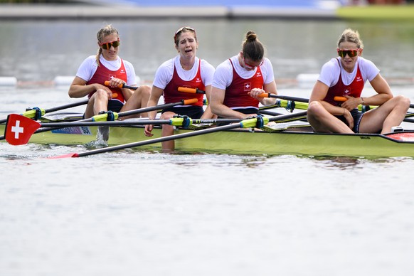 Fourth placed Switzerland&#039;s Fabienne Schweizer, Pascale Walker, Lisa Loetscher and Celia Dupre react after crossing the finish line during the women&#039;s rowing Quadruple Sculls Final A at the  ...