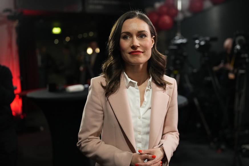 Finnish Prime Minister Sanna Marin, Social Democratic Party chair, watches results of exit polls in Helsinki, Finland, Sunday, April 2, 2023. (AP Photo/Sergei Grits)