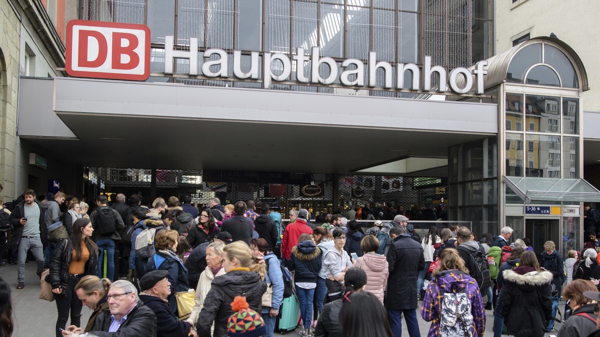 Travelers wait in front of the main train station in Munich, Germany, Wednesday, Oct. 31, 2018. Authorities investigating an 'ownerless bag' at Munich train station and have partially evacua ...