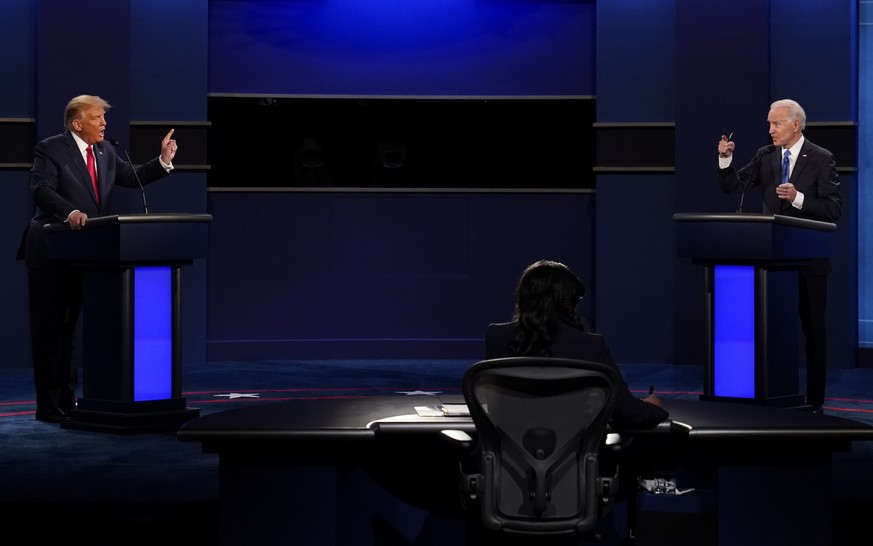 FILE - U.S. President Donald Trump, left, and Democratic presidential candidate former Vice President Joe Biden attend the second and final presidential debate Oct. 22, 2020, at Belmont University in  ...