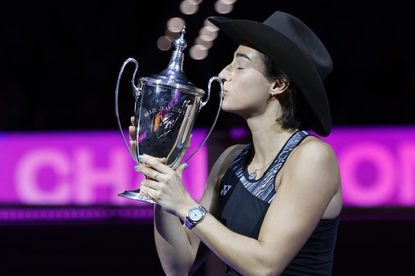 Caroline Garcia, of France, kisses the trophy after defeating Aryna Sabalenka, of Belarus, in the singles final at the WTA Finals tennis tournament in Fort Worth, Texas, Monday, Nov. 7, 2022. (AP Phot ...