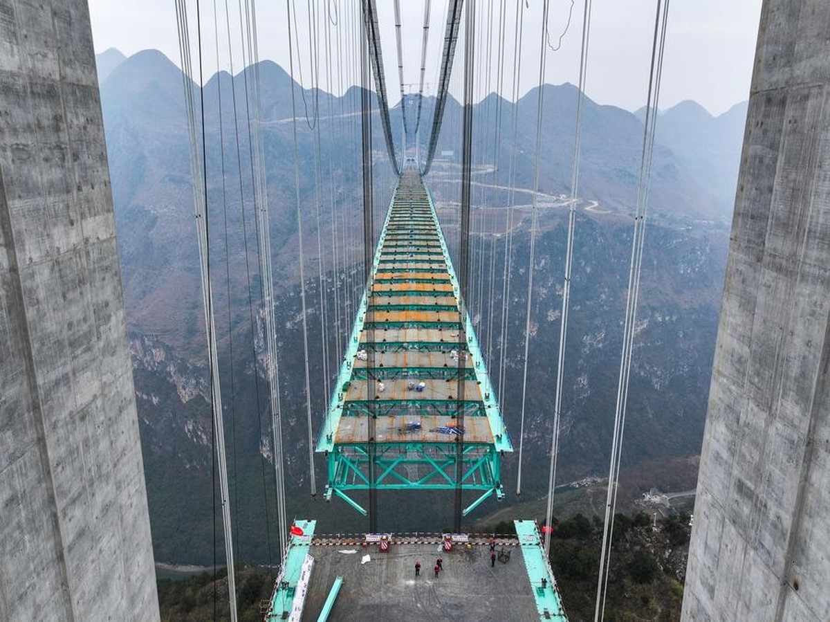 (250114) -- ZHENFENG, Jan. 14, 2025 (Xinhua) -- An aerial drone photo shows the construction site of the Huajiang grand canyon bridge in southwest China's Guizhou, Jan. 14, 2025. By far, 93 secti ...