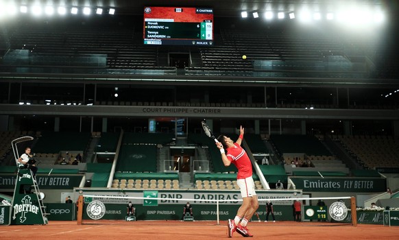 epa09241965 Novak Djokovic of Serbia serves during the 1st round match against Tennys Sandgren of the US at the French Open tennis tournament at Roland Garros in Paris, France, 01 June 2021. EPA/CHRIS ...