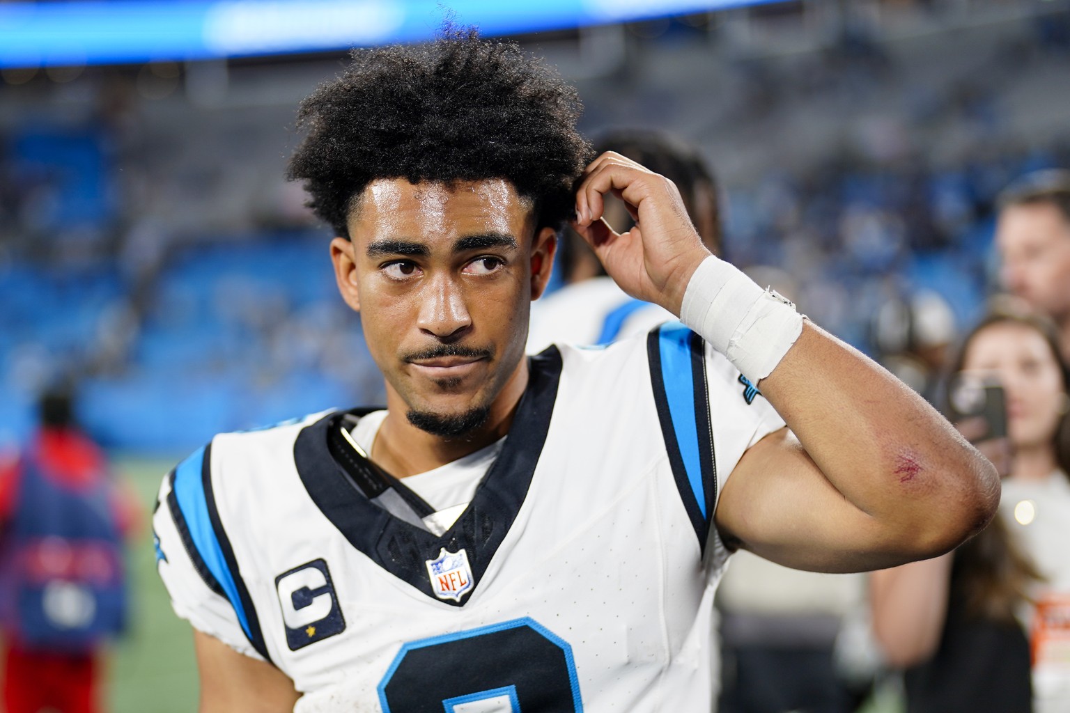 Carolina Panthers quarterback Bryce Young leaves the field after their loss against the New Orleans Saints in an NFL football game Monday, Sept. 18, 2023, in Charlotte, N.C. (AP Photo/Jacob Kupferman)