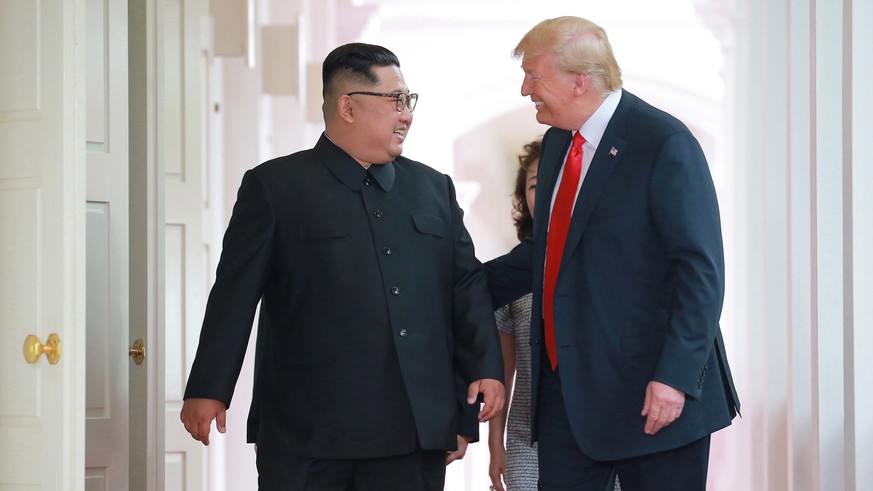 epa06803341 A photo released by the official North Korean Central News Agency (KCNA) shows Korean leader Kim Jong Un and US President Donald J. Trump during a summit at Sentosa Island, Singapore, 12 J ...