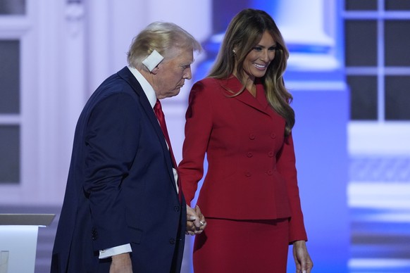Republican presidential candidate former President Donald Trump is joined on stage by former first lady Melania Trump at the Republican National Convention Thursday, July 18, 2024, in Milwaukee. (AP P ...