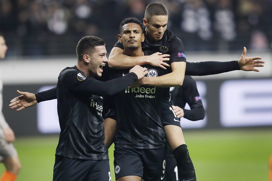 Frankfurt&#039;s scorer Sebastien Haller, center, Luka Jovic, left, and Mijat Gacinovic celebrate their side&#039;s second goal during the second leg, round of 32, Europa League soccer match between E ...