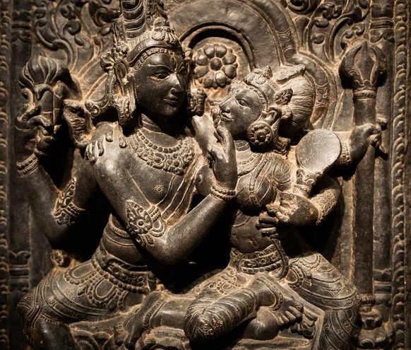 Turin, Italy - April, 2023: Oriental Art Museum. Shiva and Parvati, 10th Century A.D. For Hinduism religion the couple is symbol of love and devotion - traditional practice of sex, tantra and kamasutr ...