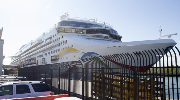 FILE - The cruise ship Norwegian Dawn is docked on May 22, 2015, at the Black Falcon Terminal in Boston. The U.S.-owned cruise ship with more than 3,000 passengers and crew onboard was finally allowed ...