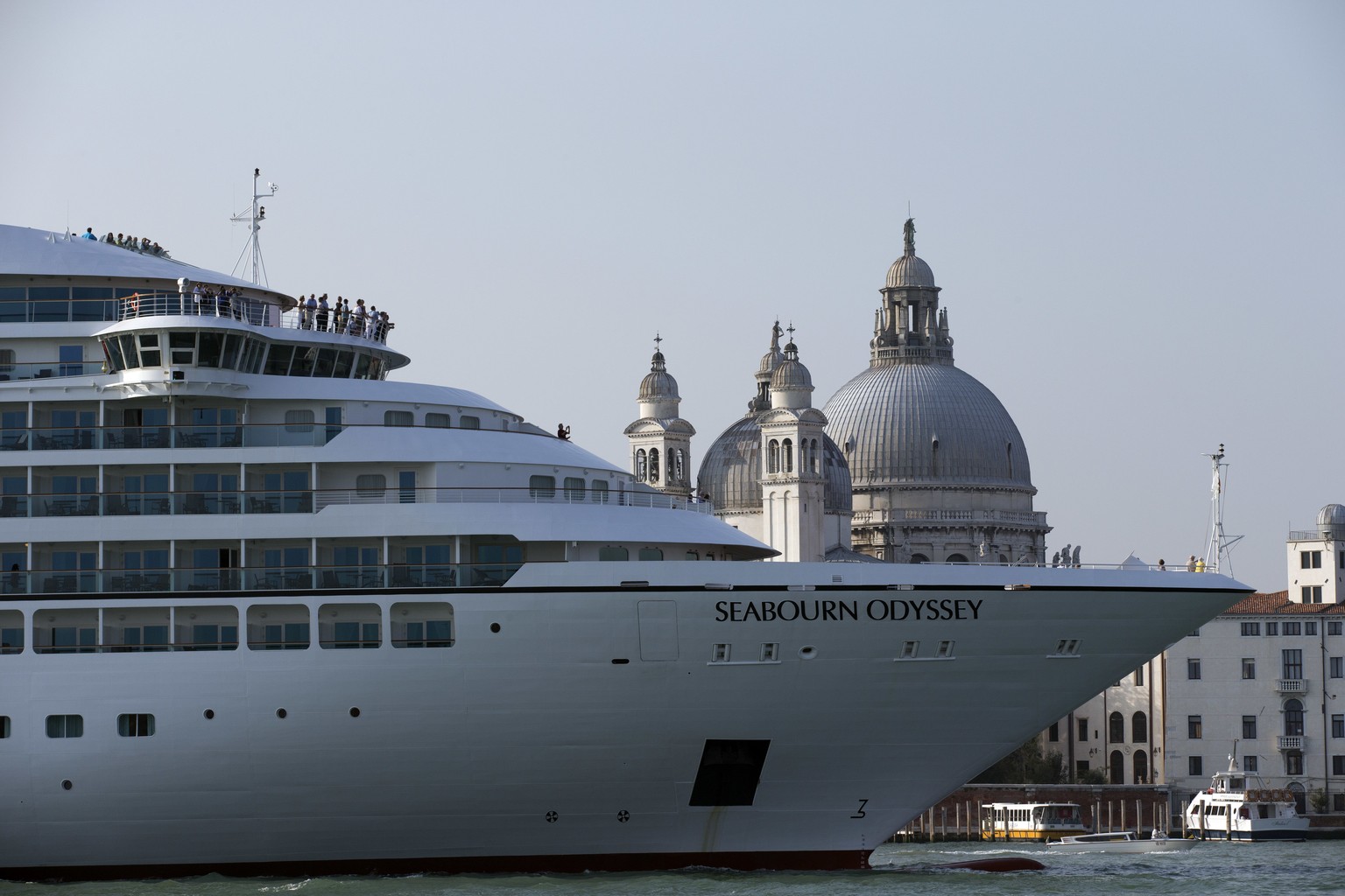 FILE-- In this Sept. 27, 2014 file photo a cruise ship transits in the Giudecca canal in front of St. Mark&#039;s Square, in Venice, Italy. Declaring Venice&#039;s waterways a