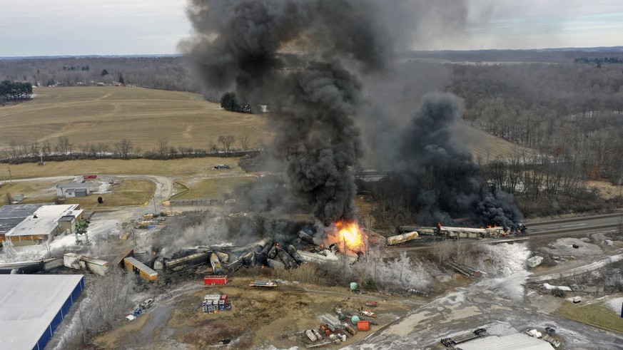 This photo taken with a drone shows portions of a Norfolk Southern freight train that derailed Friday night in East Palestine, Ohio are still on fire at mid-day Saturday, Feb. 4, 2023. (AP Photo/Gene  ...