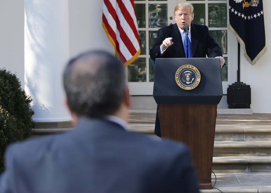 epa07372971 US President Donald J. Trump gets into an exchange with reporter Brian J. Karem (L) as Trump answers questions after speaking about a 328 billion USD (290.7 billion euro) spending bill to  ...