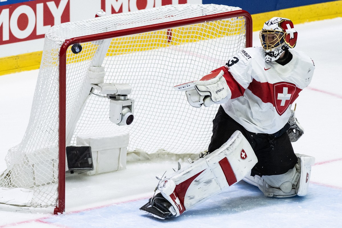epa09963262 Switzerland's goalie Leonardo Genoni in action during the IIHF Ice Hockey World Championship group A preliminary round match between Switzerland and Canada in Helsinki, Finland, 21 Ma ...