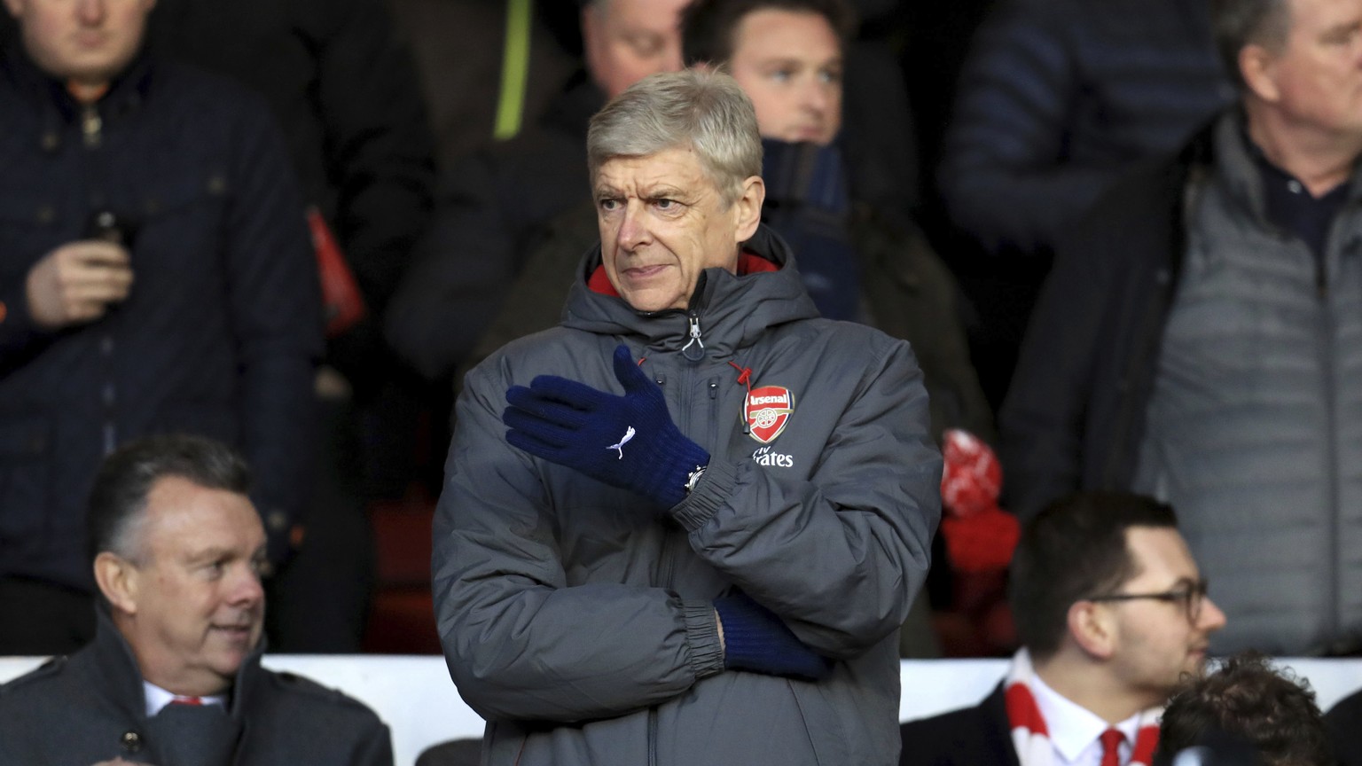 Arsenal manager Arsene Wenger gestures from the stands during the English FA Cup, Third Round soccer match between Nottingham Forest and Arsenal at the City Ground, Nottingham, England, Sunday, Jan. 7 ...