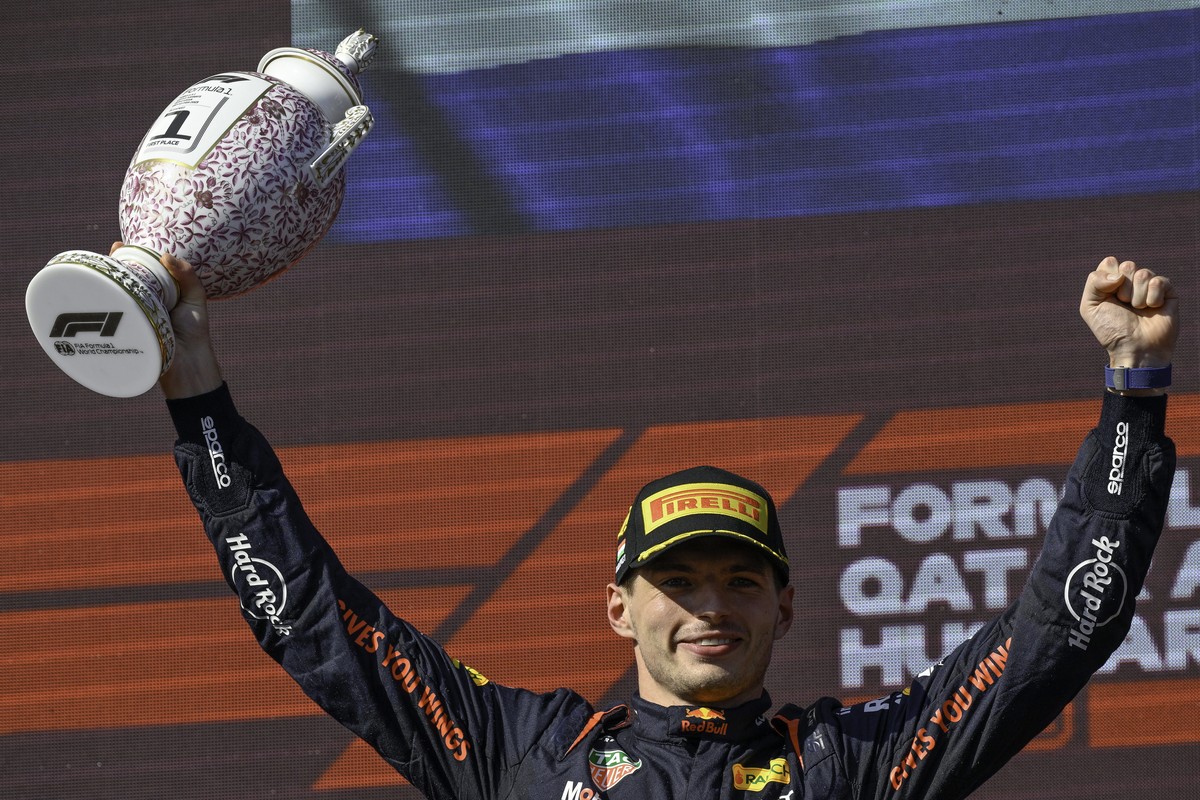 epa10764506 Red Bull driver Max Verstappen of the Netherlands celebrates on the podium after winning the Hungarian Formula One Grand Prix at the Hungaroring circuit, in Mogyorod, near Budapest, Hungar ...