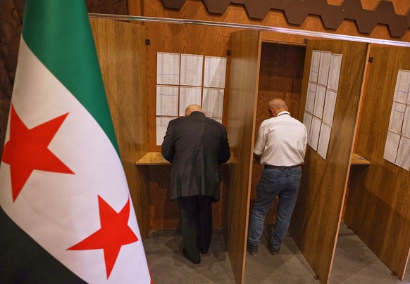 Electoral college members collect their ballots for a parliamentary election at a polling station in Aleppo, Syria, Sunday, Oct. 5, 2025. (AP Photo/Omar Albam)
Syria Election