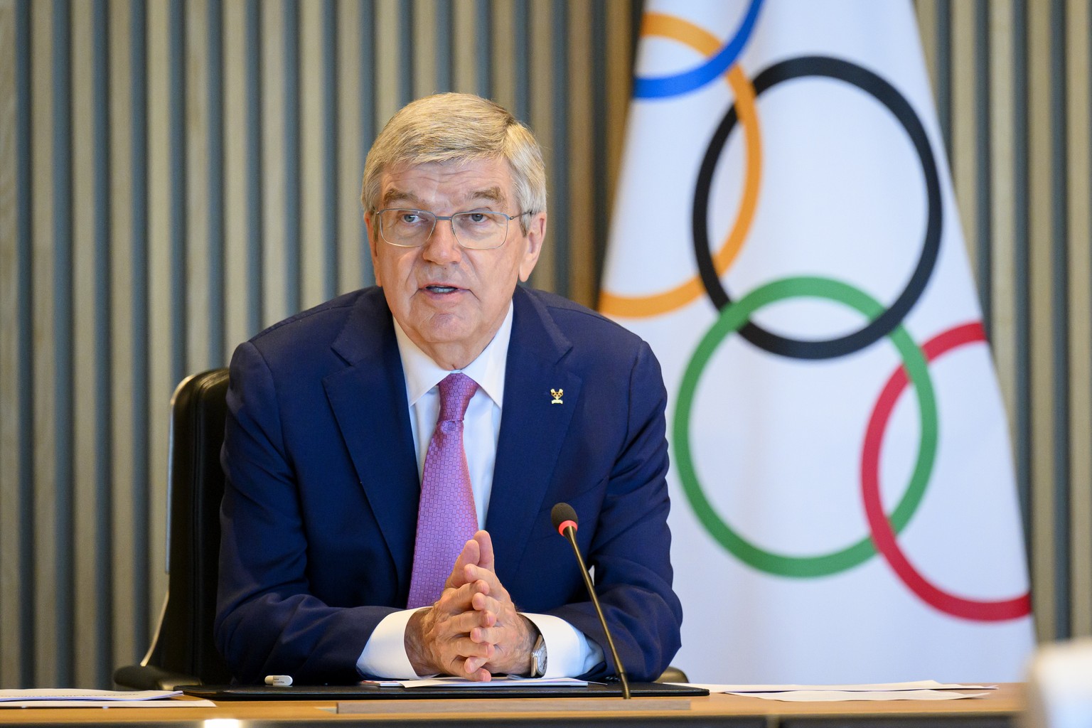 epa11229034 International Olympic Committee (IOC) President Thomas Bach speaks at the opening of the executive board meeting of the International Olympic Committee, at the Olympic House, in Lausanne,  ...
