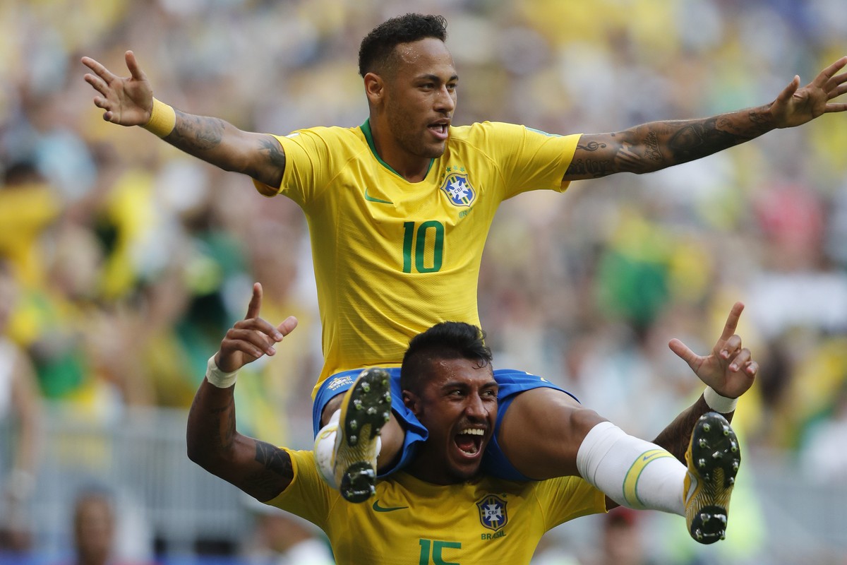 Brazil's Neymar, top, celebrates with team mate Paulinho after scoring his side's opening goal during the round of 16 match between Brazil and Mexico at the 2018 soccer World Cup in the Sama ...