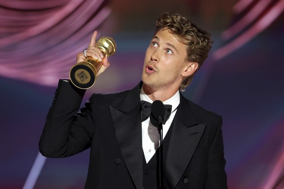 This image released by NBC shows Austin Butler accepting the award for Best Actor in a Motion Picture?  Drama Prize for "elvis" at the 80th Annual Golden Globe Awards at the Beverly Hilton Hotel o…